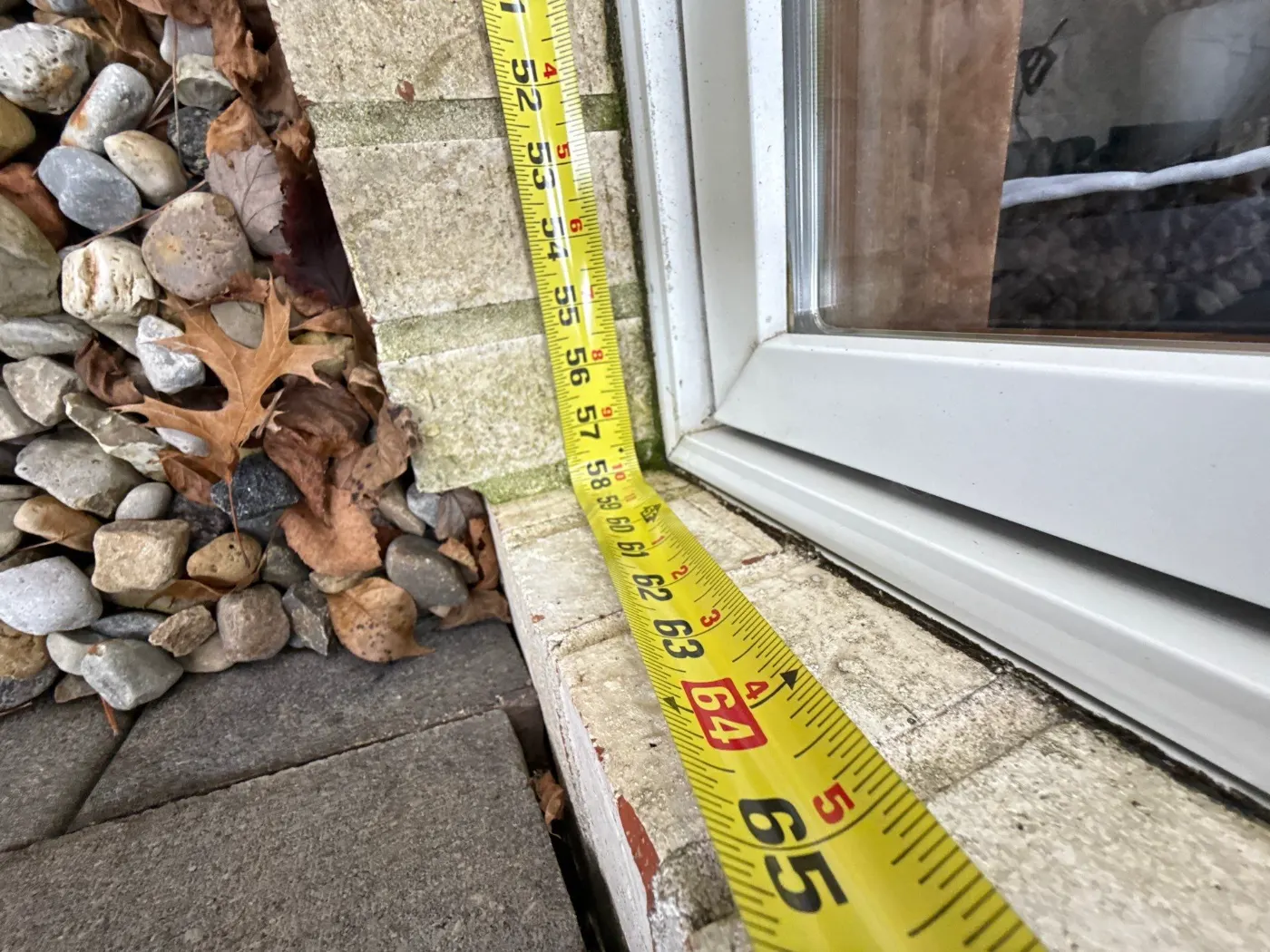 Storm-damaged window documented in Williams Glen